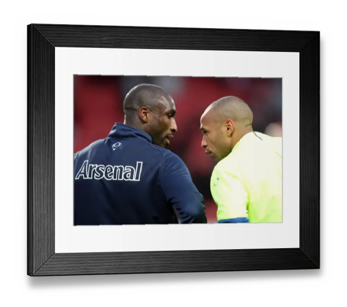 Framed Print : Sol Campbell (Arsenal) chats with Thierry Henry (Barcelona and Ex Arsenal) before the match