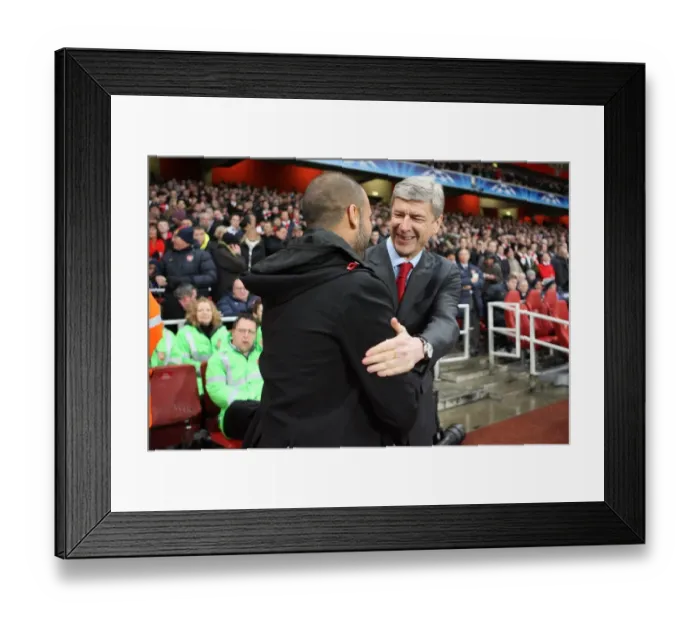 Framed Print : Arsene Wenger the Arsenal Manager shakes hands with Josep Guardiola the Barcelona Manager before the match. Arsenal 2: 2 Barcelona. UEFA Champions League. Quarter Final, 1st Leg. Emirates Stadium, 31  /  3  /  10. Credit : Arsenal Football Club  / 