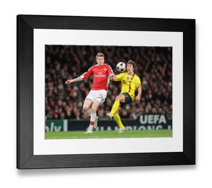Framed Print : Nicklas Bendtner (Arsenal) Carlos Puyol (Barcelona). Arsenal 2: 2 Barcelona Framed Print : Nicklas Bendtner (Arsenal) Carlos Puyol (Barcelona). Arsenal 2: 2 Barcelona