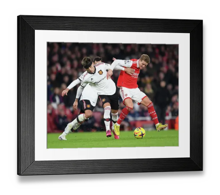Framed Print : Arsenal vs Manchester United: Martin Odegaard vs Lisandro Martinez Clash in Premier League Showdown Framed Print : Arsenal vs Manchester United: Martin Odegaard vs Lisandro Martinez Clash in Premier League Showdown
