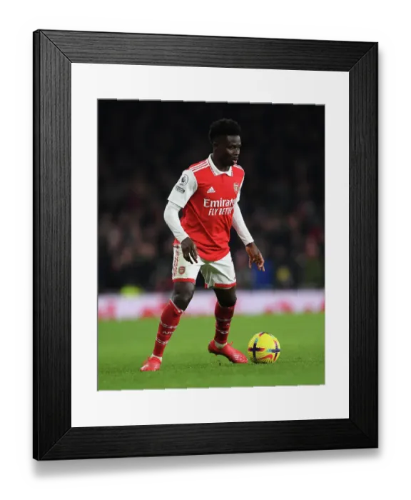 Framed Print : Bukayo Saka in Action: Arsenal vs Manchester United, Premier League 2022-23 Framed Print : Bukayo Saka in Action: Arsenal vs Manchester United, Premier League 2022-23