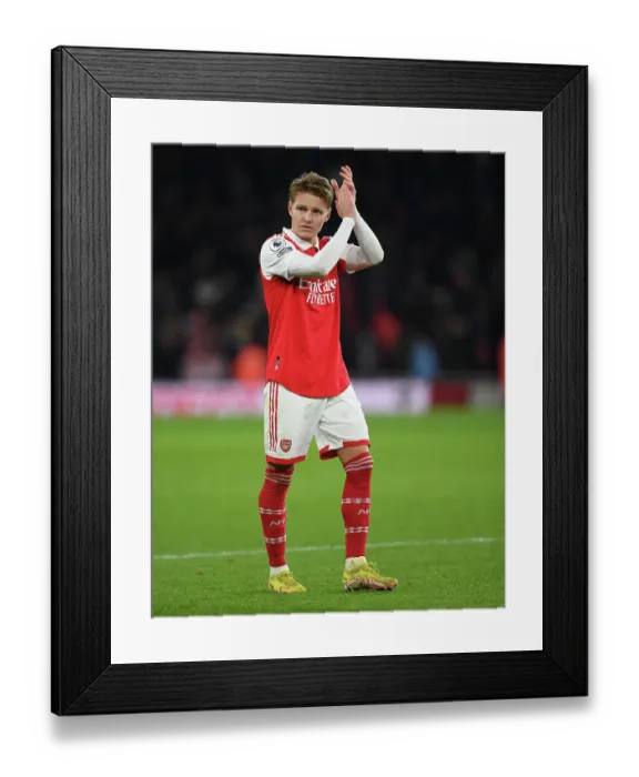 Framed Print : Arsenal's Martin Odegaard Celebrates with Fans after Arsenal vs Manchester United Win, Premier League 2022-23 Framed Print : Arsenal's Martin Odegaard Celebrates with Fans after Arsenal vs Manchester United Win, Premier League 2022-23