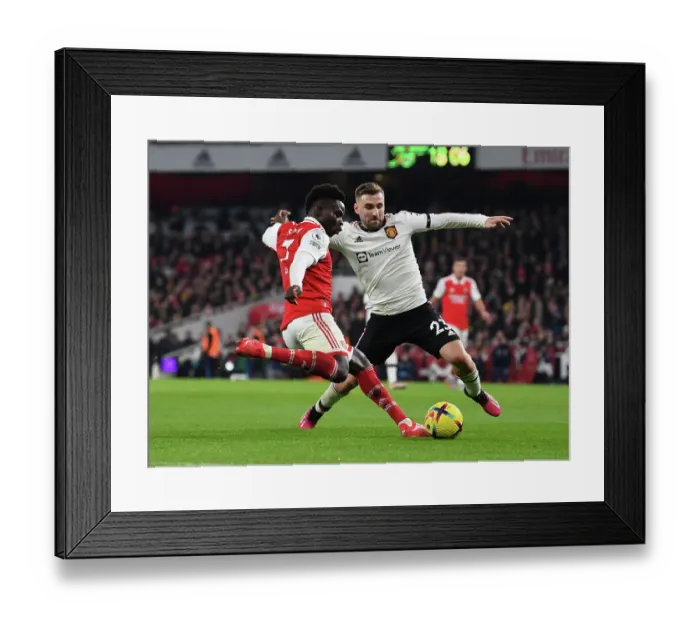 Framed Print : Arsenal's Bukayo Saka Faces Off Against Luke Shaw in Intense Arsenal v Manchester United Clash (2022-23) Framed Print : Arsenal's Bukayo Saka Faces Off Against Luke Shaw in Intense Arsenal v Manchester United Clash (2022-23)