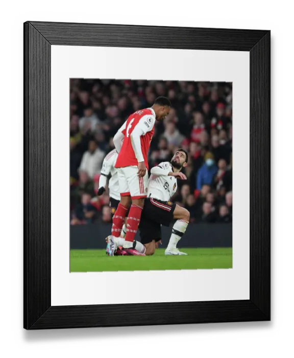 Framed Print : Gabriel vs Fernandes: A Battle of Willpower in Arsenal vs Manchester United Framed Print : Gabriel vs Fernandes: A Battle of Willpower in Arsenal vs Manchester United