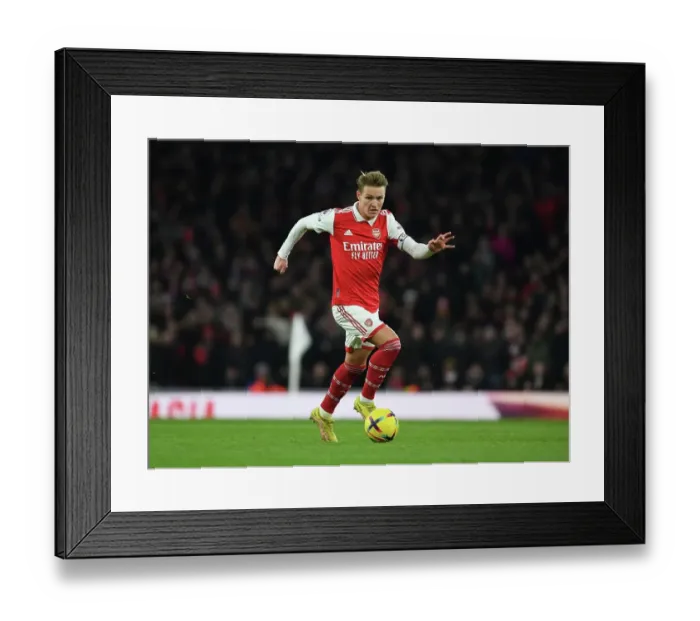 Framed Print : Martin Odegaard vs Manchester United: Arsenal's Midfield Showdown (2022-23)
