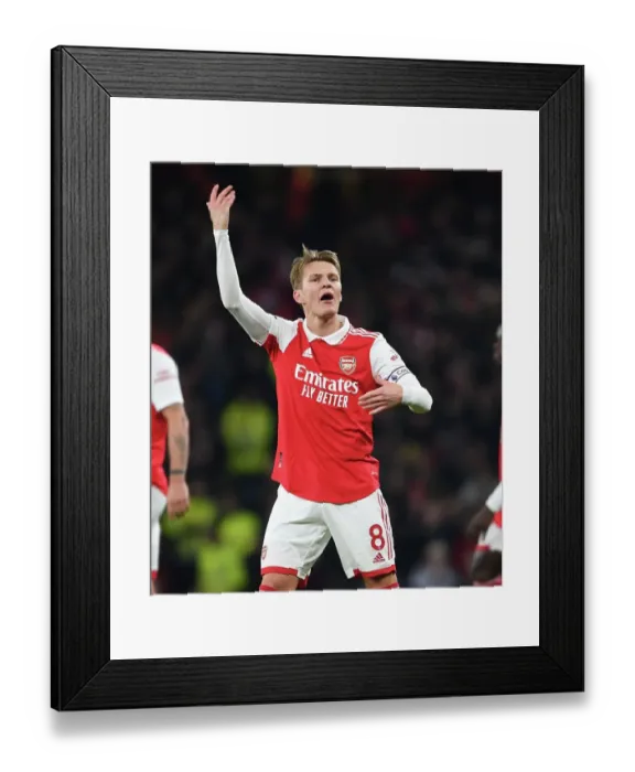 Framed Print : Arsenal's Martin Odegaard Faces Manchester United in Premier League Showdown (2022-23)