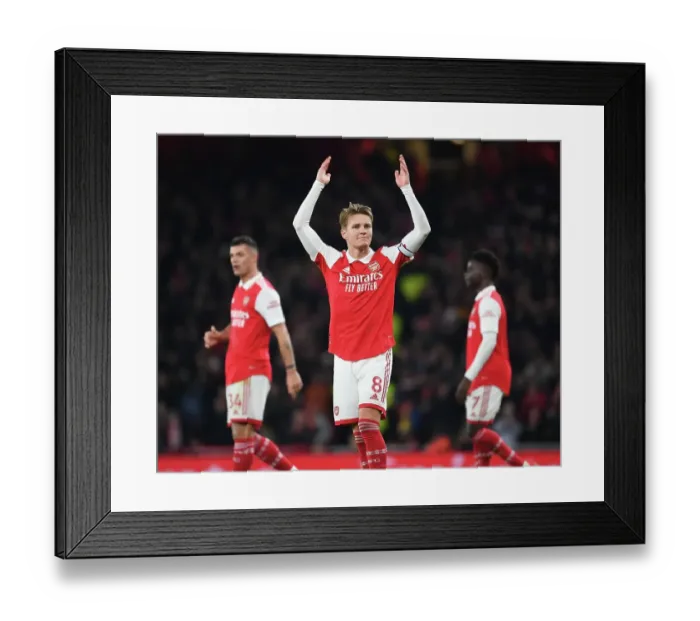 Framed Print : Arsenal's Odegaard Takes on Manchester United: A Premier League Showdown (2022-23)