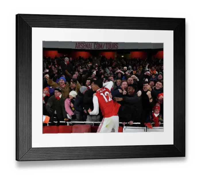 Framed Print : Arsenal Celebrates Third Goal Against Manchester United: Saliba's Emotional Moment with Fans (2022-23) Framed Print : Arsenal Celebrates Third Goal Against Manchester United: Saliba's Emotional Moment with Fans (2022-23)