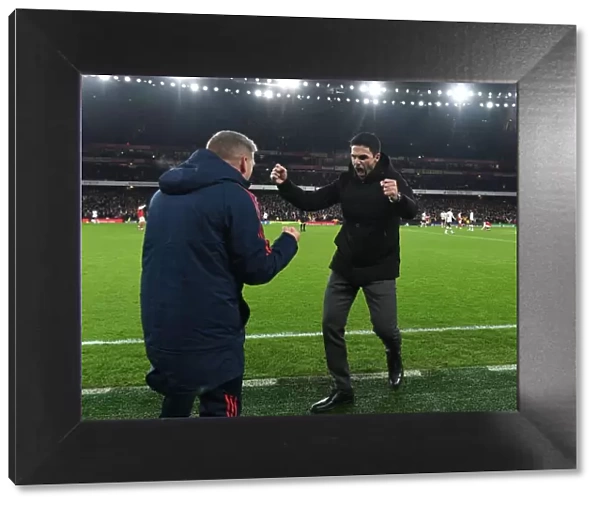 Arsenal's Victory: Mikel Arteta and Steve Round Celebrate Over Manchester United in the Premier League