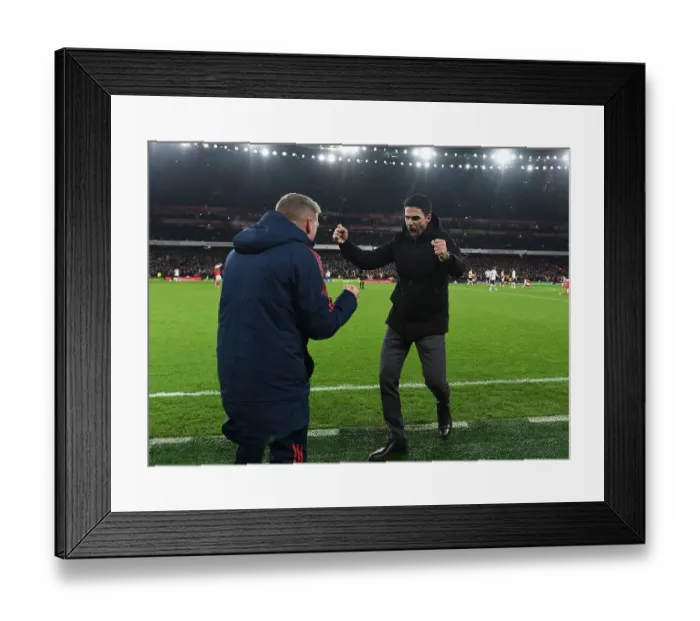 Framed Print : Arsenal's Victory: Mikel Arteta and Steve Round Celebrate Over Manchester United in the Premier League