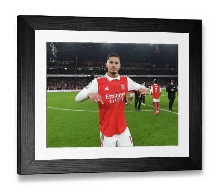 Framed Print : Arsenal's William Saliba Celebrates Thrilling Victory Over Manchester United in the Premier League (2022-23)