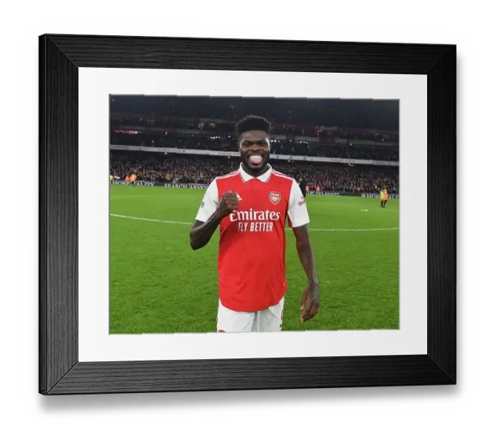 Framed Print : Thomas Partey's Triumphant Moment: Arsenal's Euphoric Victory Over Manchester United (2022-23)