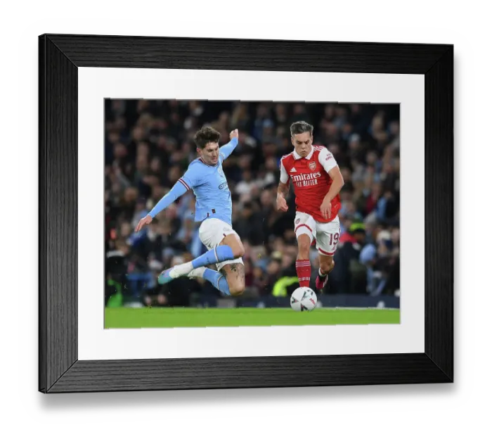 Framed Print : Manchester City vs Arsenal: Trossard vs Stones in FA Cup Clash (2022-23) Framed Print : Manchester City vs Arsenal: Trossard vs Stones in FA Cup Clash (2022-23)