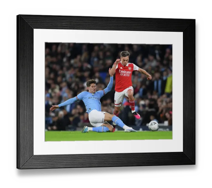 Framed Print : FA Cup Showdown: Trossard vs Stones - A Battle of Champions at Etihad Stadium (2022-23)