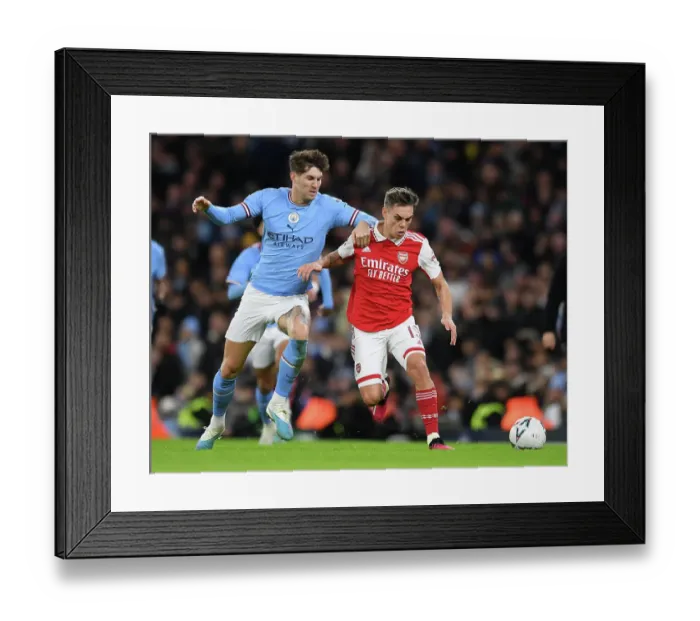 Framed Print : Trossard vs. Stones: Clash of the Titans - Manchester City vs. Arsenal, Emirates FA Cup Fourth Round