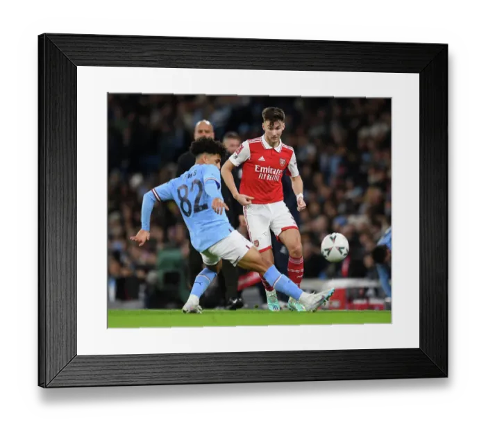 Framed Print : Arsenal's Kieran Tierney Faces Pressure from Manchester City's Rico Lewis in FA Cup Clash