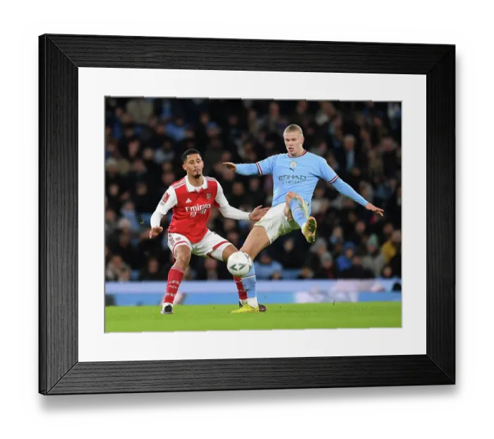 Framed Print : Clash of Titans: Saliba Stands Firm Against Haaland in FA Cup Battle - Manchester City vs Arsenal (2022-23)