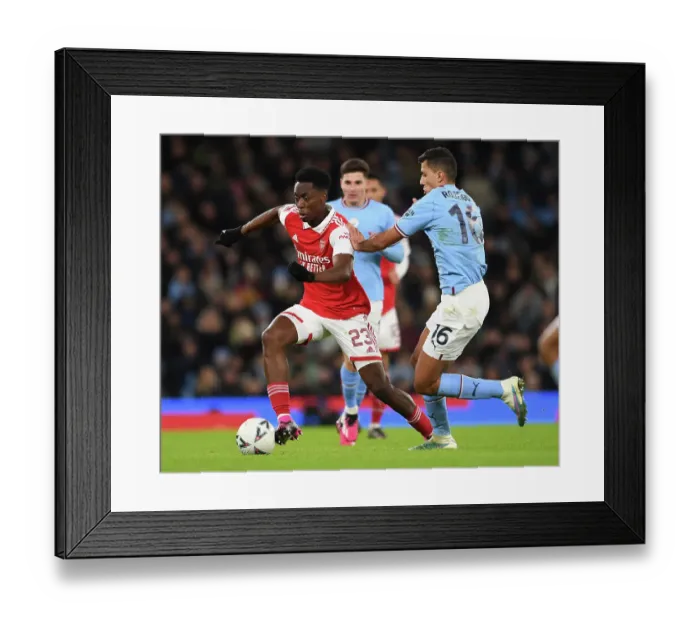 Framed Print : Arsenal's Albert Sambi Lokonga Faces Off Against Rodrigo in Manchester City vs Arsenal FA Cup Clash (2022-23)