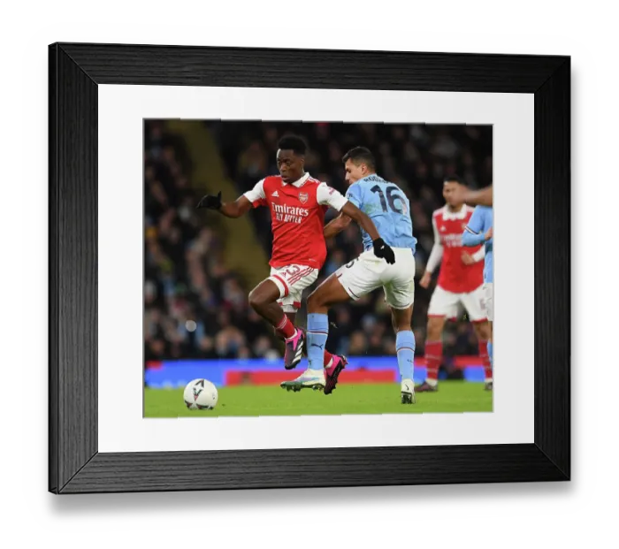 Framed Print : Arsenal's Albert Sambi Lokonga Clashes with Manchester City's Rodrigo in Emirates FA Cup Showdown