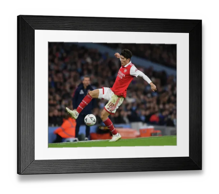 Framed Print : Arsenal's Tomiyasu Takes on Manchester City in FA Cup Battle Framed Print : Arsenal's Tomiyasu Takes on Manchester City in FA Cup Battle