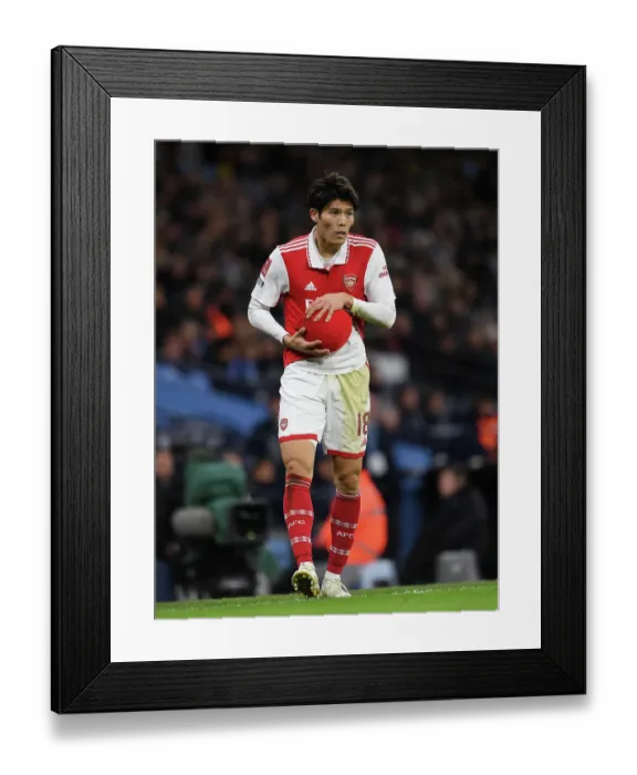 Framed Print : Arsenal's Tomiyasu Faces Off Against Manchester City in FA Cup Clash Framed Print : Arsenal's Tomiyasu Faces Off Against Manchester City in FA Cup Clash