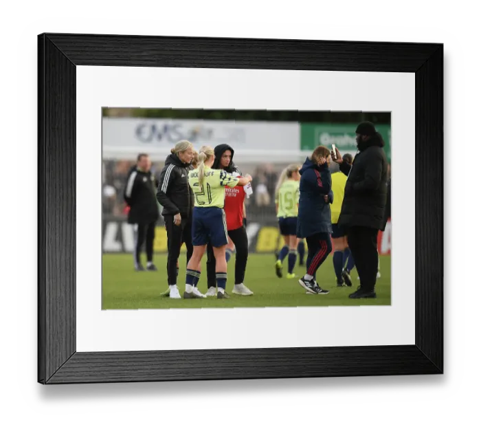 Framed Print : Arsenal's Leah Williamson Graciously Honors Defeated Leeds Player with Shirt Post-FA Cup Victory