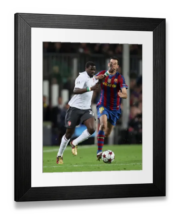 Framed Print : Emmanuel Eboue (Arsenal) Sergio Basquets (Barcelona). Barcelona 4: 1 Arsenal