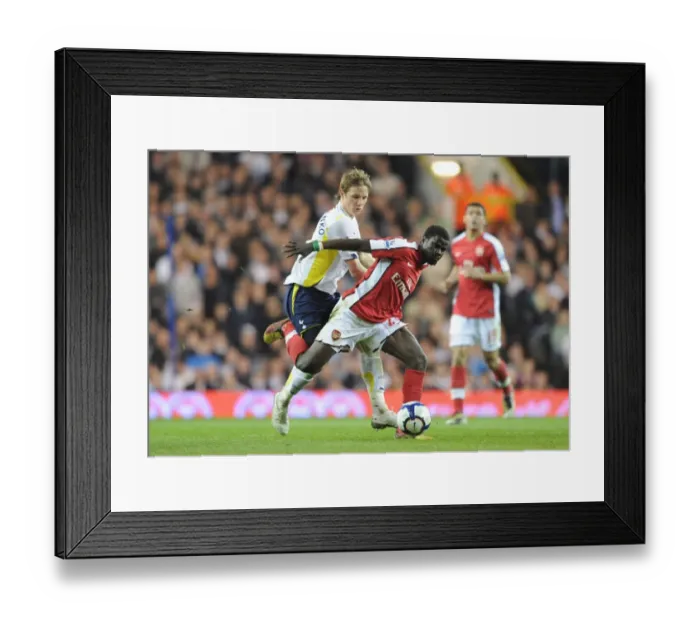 Framed Print : Clash of Rivals: Eboue vs. Pavlyuchenko in the North London Derby