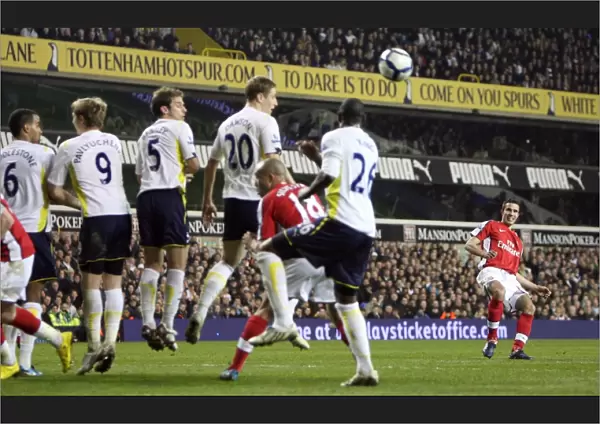 Robin van Persie (Arsenal) bends a free kick round the Tottenham wall. Tottenham Hotspur 2