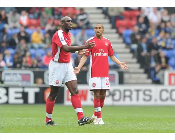 Sol Campbell and Gael Clichy (Arsenal). Wigan Athletic 3: 2 Arsenal, FA Barclays Premier League