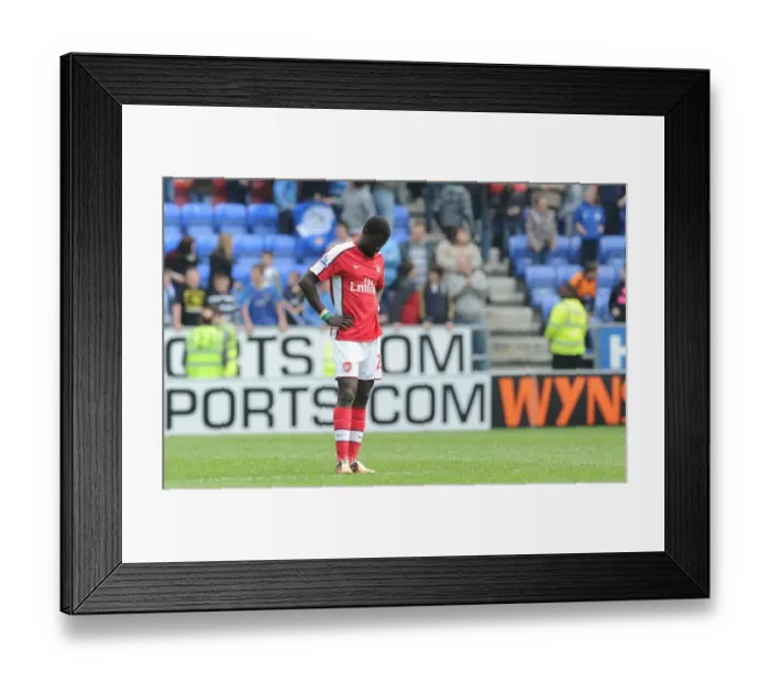 Framed Print : Emmanuel Eboue (Arsenal) dejected after the match. Wigan Athletic 3: 2 Arsenal Framed Print : Emmanuel Eboue (Arsenal) dejected after the match. Wigan Athletic 3: 2 Arsenal