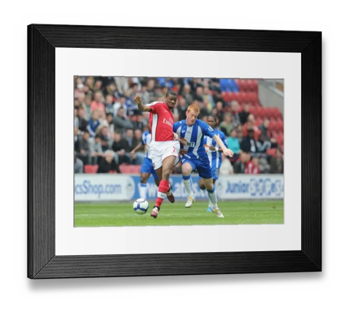 Framed Print : Abou Diaby (Arsenal) Ben Watson (Wigan). Wigan Athletic 3: 2 Arsenal, FA Barclays Premier League