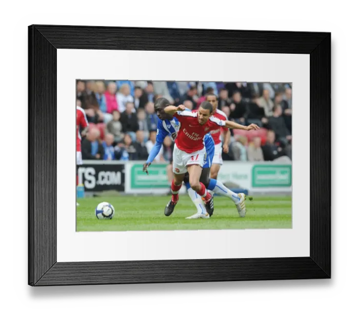Framed Print : Clash at DW Stadium: Mohamed Diame Outshines Craig Eastmond as Wigan Athletic Edge Arsenal 3-2 in FA Premier League Framed Print : Clash at DW Stadium: Mohamed Diame Outshines Craig Eastmond as Wigan Athletic Edge Arsenal 3-2 in FA Premier League