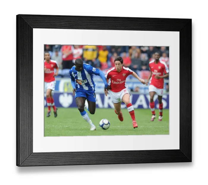 Framed Print : Nasri vs Diame: Wigan Athletic's Upset Over Arsenal in FA Premier League (3-2)