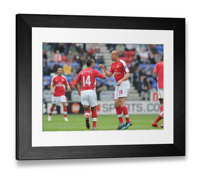 Framed Print : Mikael Silvestre and Theo Walcott: Celebrating Arsenal's 2nd Goal Against Wigan Athletic, FA Premier League, 2010