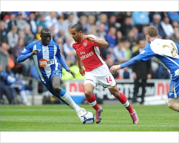 Theo Walcott (Arsenal) Mohamed Diame (Wigan). Wigan Athletic 3: 2 Arsenal