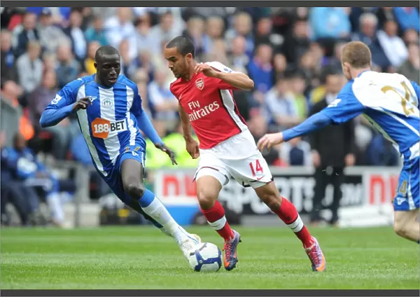 Theo Walcott (Arsenal) Mohamed Diame (Wigan). Wigan Athletic 3: 2 Arsenal