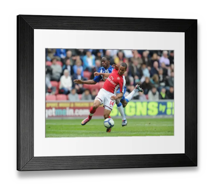 Framed Print : Theo Walcott breaks past Wigan defender Maynor Figueroa to score the 1st Arsenal goal