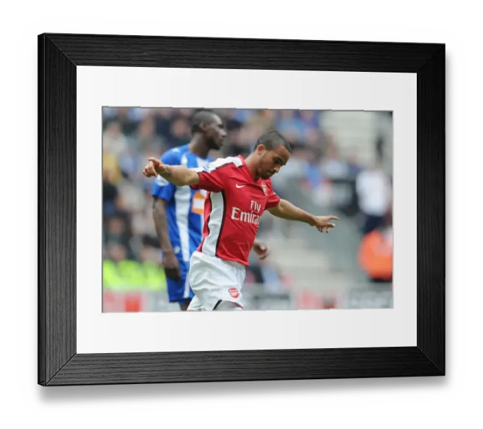 Framed Print : Theo Walcott celebrates scoring the 1st Arsenal goal. Wigan Athletic 3: 2 Arsenal