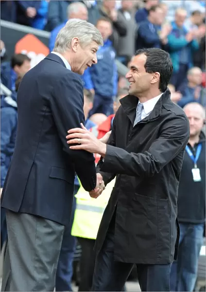 Arsenal manager Arsene Wenger with Wigan manager Roberto Martinez. Wigan Athletic 3