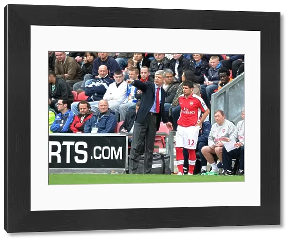 Arsenal manager Arsene Wenger with substitute Fran Merida. Wigan Athletic 3: 2 Arsenal