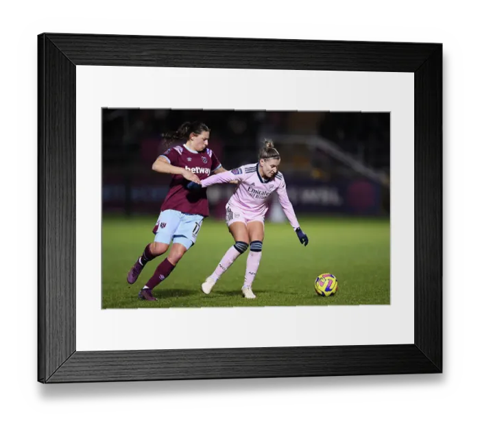 Framed Print : Arsenal vs. West Ham United: A Battle for Supremacy in the Women's Super League - Fighting for Possession