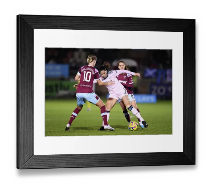 Framed Print : Arsenal vs. West Ham United: A Battle for Possession in the Barclays Women's Super League