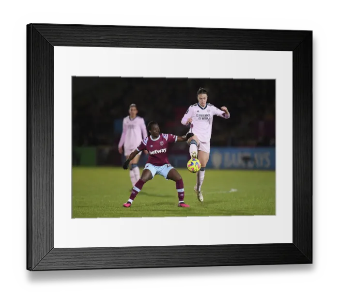 Framed Print : Arsenal vs. West Ham United: A Battle for Possession in the Women's Super League