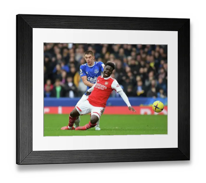 Framed Print : Saka vs Mykolenko: A Premier League Battle at Goodison Park Framed Print : Saka vs Mykolenko: A Premier League Battle at Goodison Park