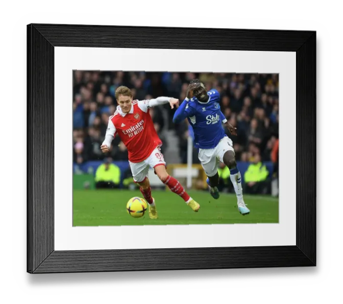 Framed Print : Martin Odegaard vs. Amadou Onana: A Battle of Midfield Titans in the Premier League Framed Print : Martin Odegaard vs. Amadou Onana: A Battle of Midfield Titans in the Premier League