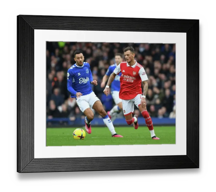 Framed Print : Arsenal's Ben White Faces Off Against Everton's Dwight McNeil in Premier League Clash Framed Print : Arsenal's Ben White Faces Off Against Everton's Dwight McNeil in Premier League Clash