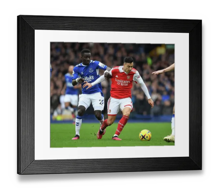 Framed Print : Martinelli Outsmarts Gueye: Premier League Clash Between Arsenal and Everton (2022-23) Framed Print : Martinelli Outsmarts Gueye: Premier League Clash Between Arsenal and Everton (2022-23)