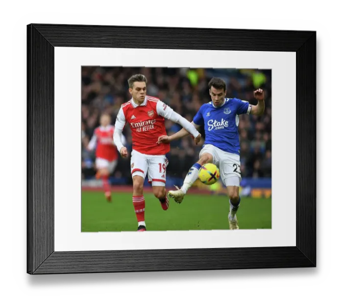 Framed Print : Arsenal's Trossard Clashes with Everton's Coleman in Premier League Showdown Framed Print : Arsenal's Trossard Clashes with Everton's Coleman in Premier League Showdown