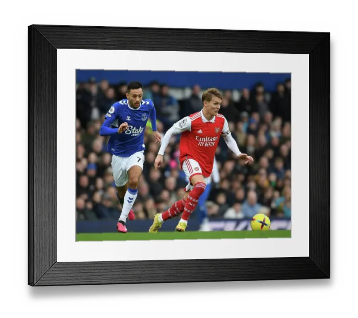 Framed Print : Odegaard vs. McNeil: A Premier League Battle at Goodison Park Framed Print : Odegaard vs. McNeil: A Premier League Battle at Goodison Park
